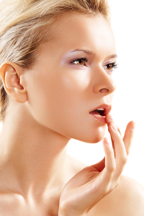 Health & skin care. Lovely woman touching her lips